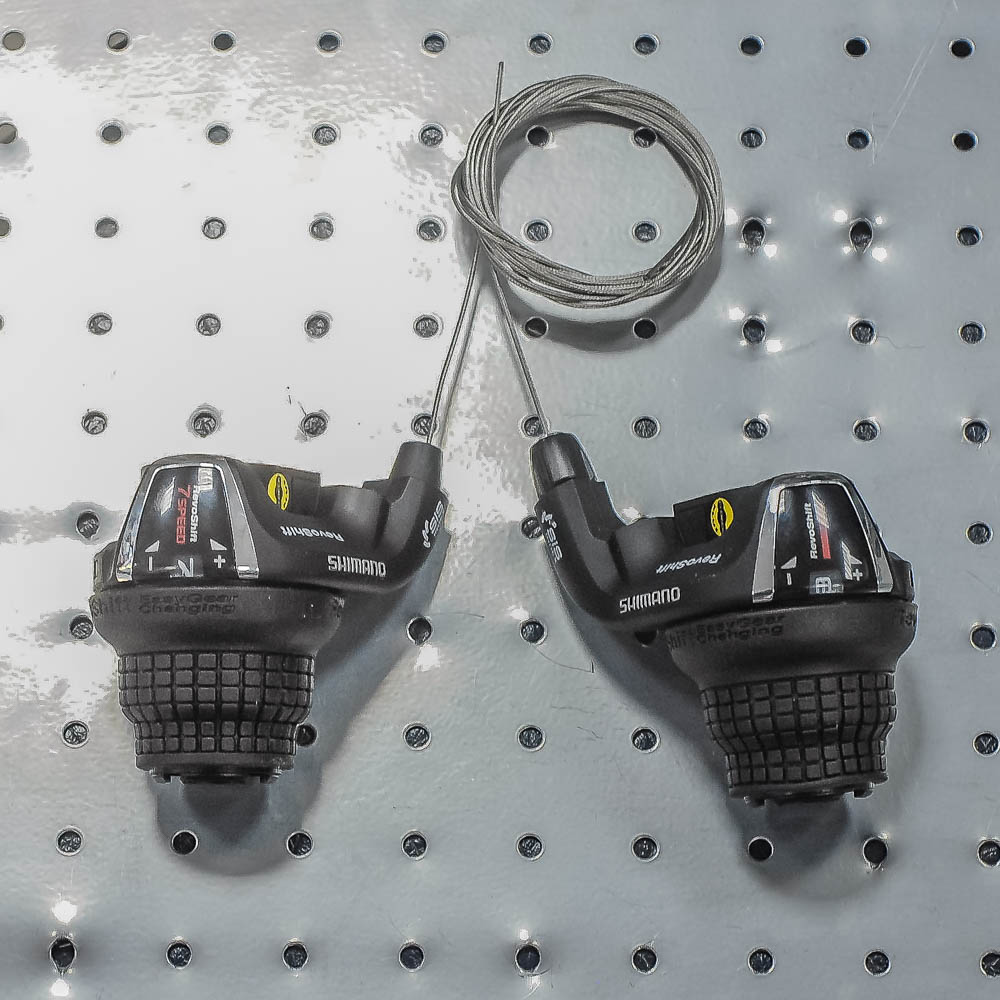 Шифтеры комплект Tourney лев/прав 3x7-скор. , трос+оплет. ESLTX50P7FAT